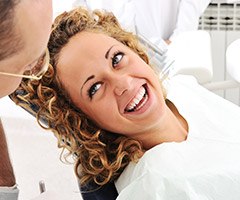 woman smiling bright at dentist