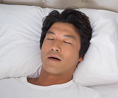 man sleeping with mouth open