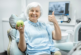 Senior woman smiling at dentist appointment