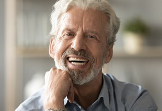 closeup of man smiling with dentures