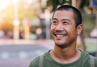 Man smiling with dental implants