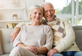 Couple smiling with dental implants in Owasso