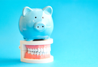 A piggy bank symbolizing the affordable cost of Invisalign in Owasso