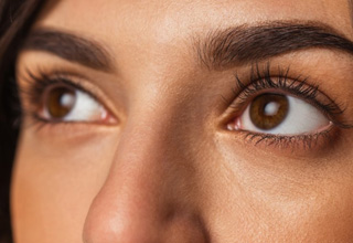 a woman with long and lush eyelashes