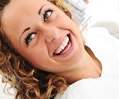 woman smiling with blonde curly hair