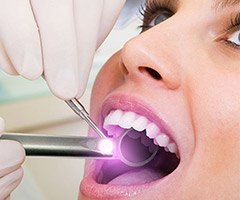 woman getting oral cancer screening