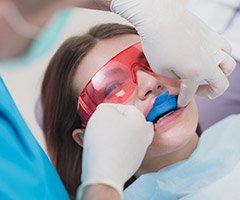 girl getting fluoride treatments