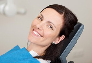 woman laying back in exam chair