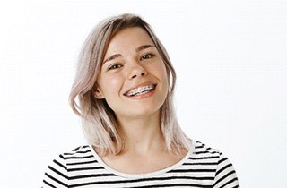 Young woman smiling with braces