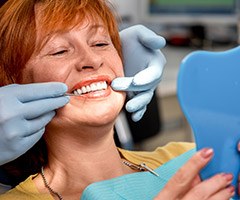 dentist showing woman her smile