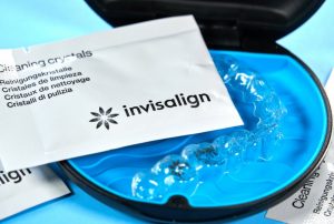 a picture of aligners and Invisalign cleaning crystals