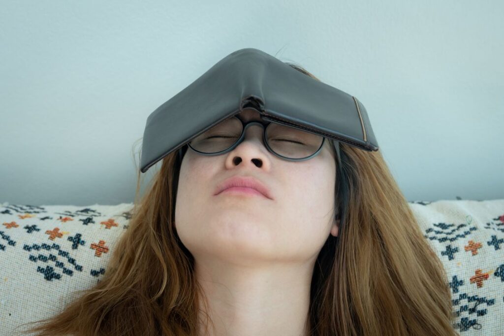 A woman with a wallet on her head
